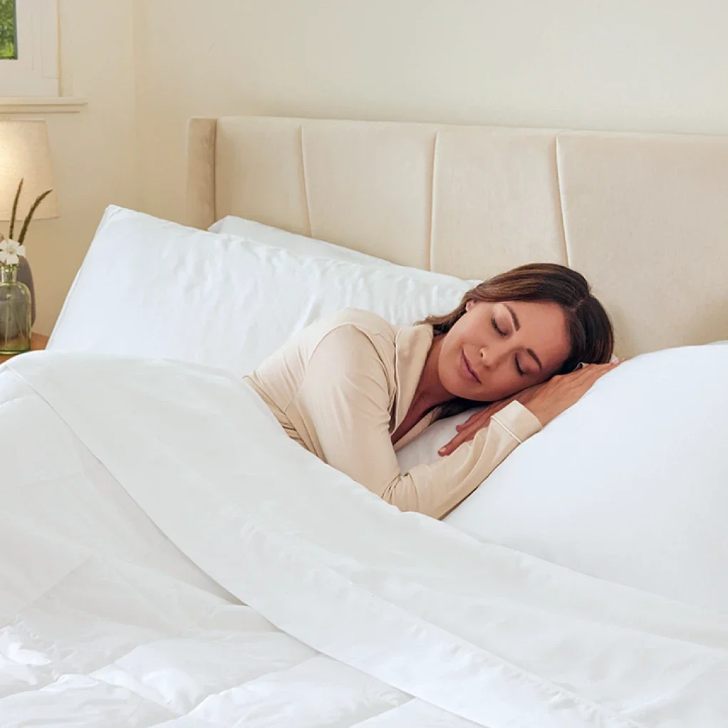 Woman sleeping peacefully on Miracle Made Sheets